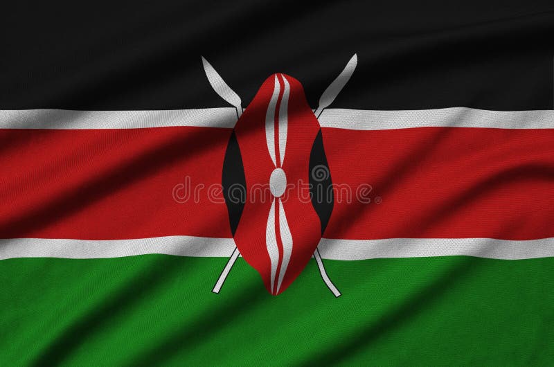 Den Kenya flaggan visas på ett sporttorkduketyg med många veck Baner för sportlag royaltyfria bilder Den Kenya flaggan visas på ett sporttorkduketyg med många veck Baner för sportlag royaltyfria bilder