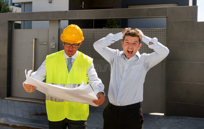 Unhappy customer in stress and constructor foreman worker with helmet and vest arguing outdoors on new house building blueprints in real state business bankrupt and housing industry concept. Unhappy customer in stress and constructor foreman worker with helmet and vest arguing outdoors on new house building blueprints in real state business bankrupt and housing industry concept