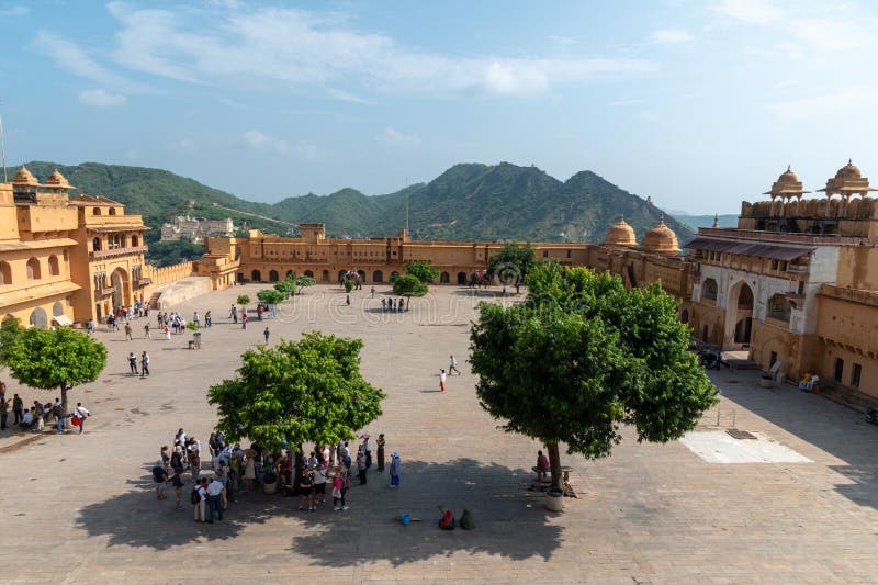 Main courtyard in the Amber Fort Amer , Rajasthan, India. Amer Fort or Amber Fort is a fort located in Amer, Rajasthan, India. Amer is a town with an area of 4 square kilometres (1.5 sq mi) located 11 kilometres (6.8 mi) from Jaipur, the capital of Rajasthan. Located high on a hill, it is the principal tourist attraction in Jaipur. Amer Fort is known for its artistic style elements. With its large ramparts and series of gates and cobbled paths, the fort overlooks Maota Lake which is the main source of water for the Amer Palace. Main courtyard in the Amber Fort Amer , Rajasthan, India. Amer Fort or Amber Fort is a fort located in Amer, Rajasthan, India. Amer is a town with an area of 4 square kilometres (1.5 sq mi) located 11 kilometres (6.8 mi) from Jaipur, the capital of Rajasthan. Located high on a hill, it is the principal tourist attraction in Jaipur. Amer Fort is known for its artistic style elements. With its large ramparts and series of gates and cobbled paths, the fort overlooks Maota Lake which is the main source of water for the Amer Palace.