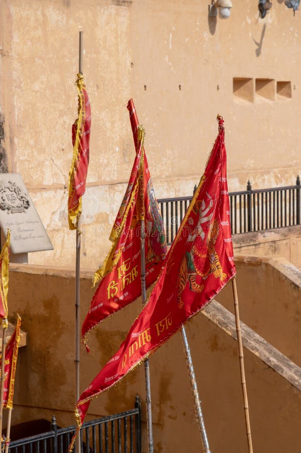 Pennants in the Main courtyard in the Amber Fort Amer , Rajasthan, India. Amer Fort or Amber Fort is a fort located in Amer, Rajasthan, India. Amer is a town with an area of 4 square kilometres (1.5 sq mi) located 11 kilometres (6.8 mi) from Jaipur, the capital of Rajasthan. Located high on a hill, it is the principal tourist attraction in Jaipur. Amer Fort is known for its artistic style elements. With its large ramparts and series of gates and cobbled paths, the fort overlooks Maota Lake which is the main source of water for the Amer Palace. Pennants in the Main courtyard in the Amber Fort Amer , Rajasthan, India. Amer Fort or Amber Fort is a fort located in Amer, Rajasthan, India. Amer is a town with an area of 4 square kilometres (1.5 sq mi) located 11 kilometres (6.8 mi) from Jaipur, the capital of Rajasthan. Located high on a hill, it is the principal tourist attraction in Jaipur. Amer Fort is known for its artistic style elements. With its large ramparts and series of gates and cobbled paths, the fort overlooks Maota Lake which is the main source of water for the Amer Palace.