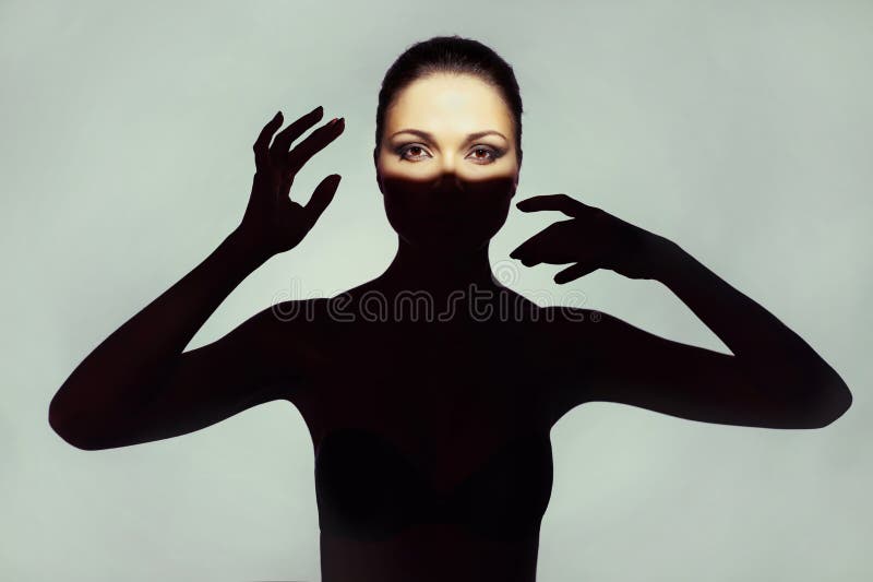 Surrealist art portrait of young lady with shadow on her body. Surrealist art portrait of young lady with shadow on her body
