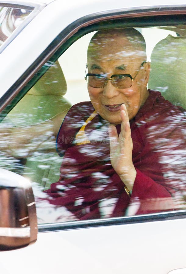 MUMBAI, INDIA – December 10 2017: The 14th Dalai Lama waves and blesses devotees as he leaves after giving a spritiual lecture at Somaiya college. MUMBAI, INDIA – December 10 2017: The 14th Dalai Lama waves and blesses devotees as he leaves after giving a spritiual lecture at Somaiya college.