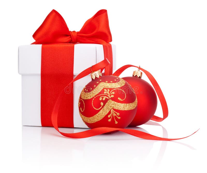 White gift box tied with Red ribbon and two decorations Christmas ball Isolated on white background. White gift box tied with Red ribbon and two decorations Christmas ball Isolated on white background