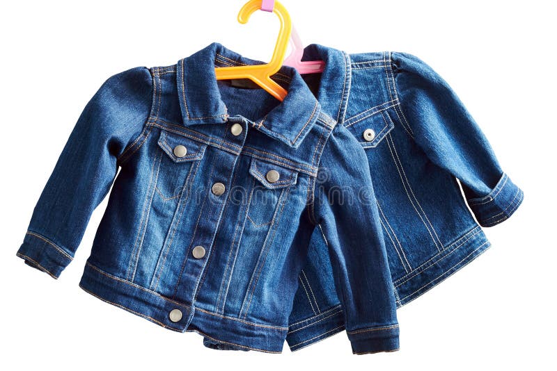 Two denim child jackets hang on a hanger on a white background. Button clasp stock images, royalty-free photos and pictures