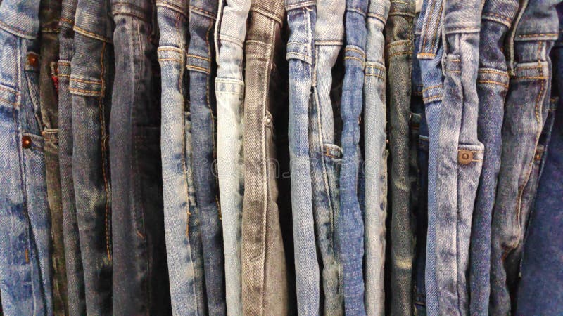 Denim Jeans in a Variety of Shades of Blue for Sale Second Hand. Stock ...