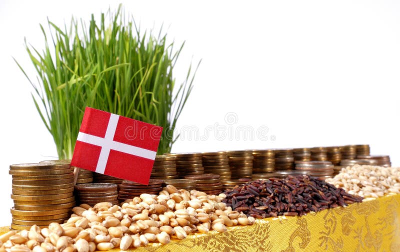 Denmark flag waving with stack of money coins and piles of wheat