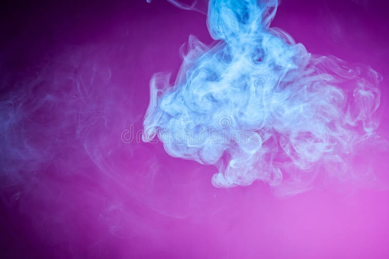 Dense multicolored blue smoke of on a pink background. Background of smoke vape