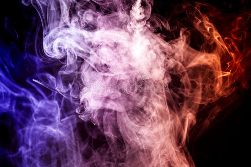 Dense multicolored smoke of red, blue and pink colors on a black isolated background. Background of smoke vape. Dense multicolored smoke of red, blue and pink colors on a black isolated background. Background of smoke vape