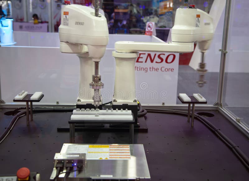 Denso dual arm control loading / unloading automation robot royalty free stock images