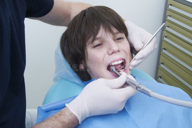 Dentist drilling a cavity. stock image. Image of oral 31714147
