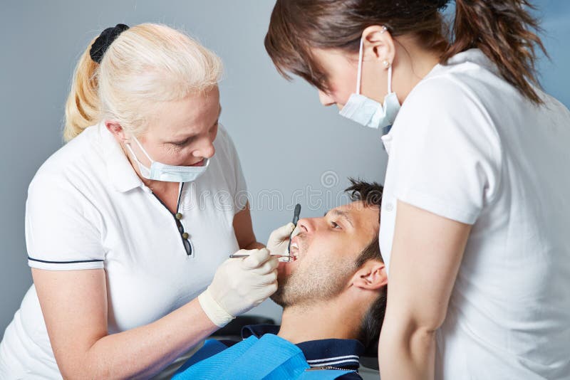 Dental Assistant Watching Dentist at Work Stock Photo Image of