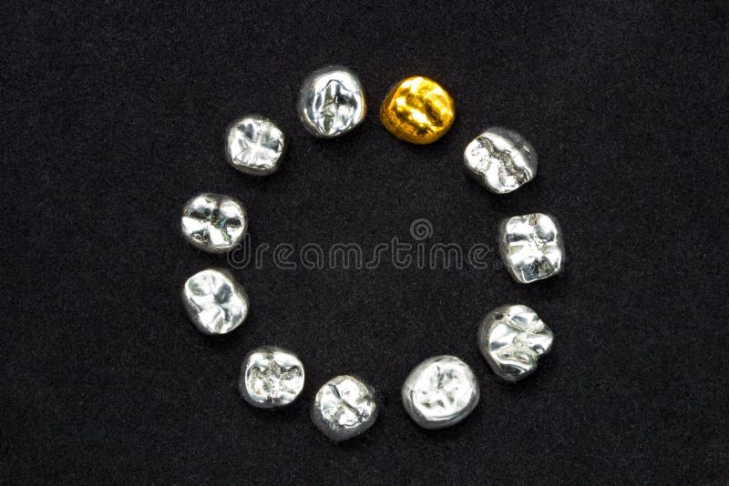 Dental Gold and Metal Tooth Crowns on Dark Black Surface. Stock Photo Image of cavity