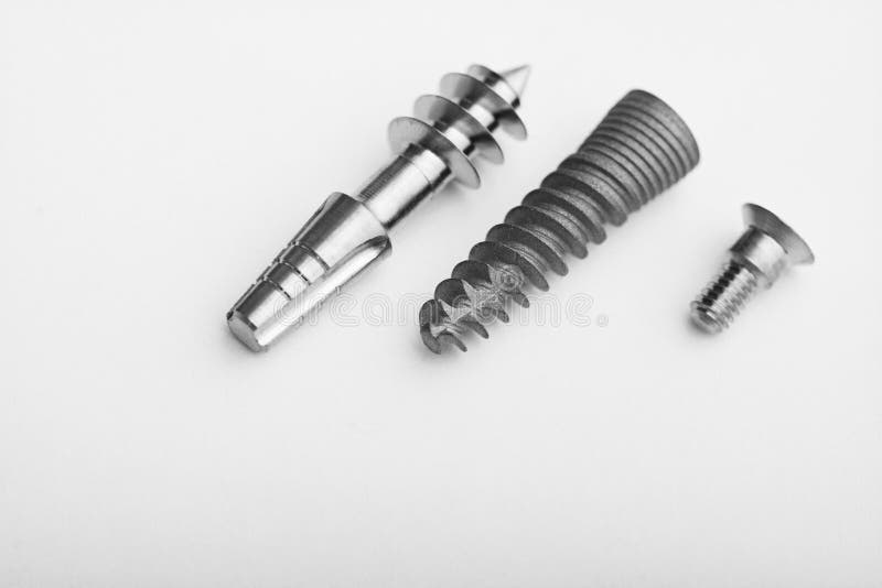 Dental implants on a light gray royalty free stock images Dental implants on a light gray royalty free stock images