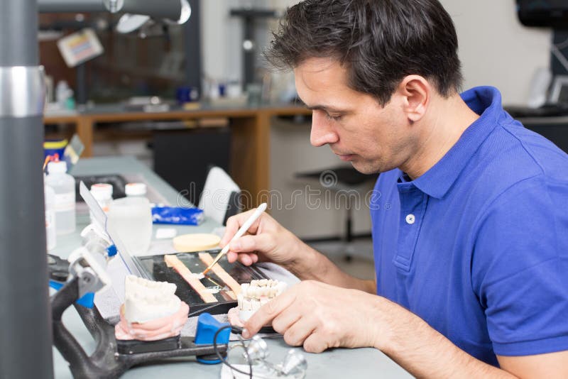 Dental Lab Technician Appying Porcelain To Mold Stock Image Image of