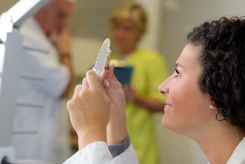 Dental Technician Looking at Prosthesis Stock Image Image of medical
