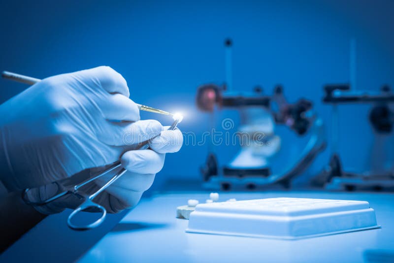 A Dental Technician Makes a Dental Crown. Laboratory. Closeup Stock