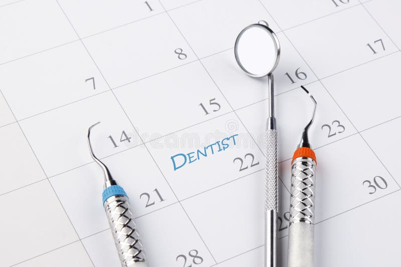 Dentist appointment in calendar with dental instruments. Dental hygienist checkup conceptual image stock images