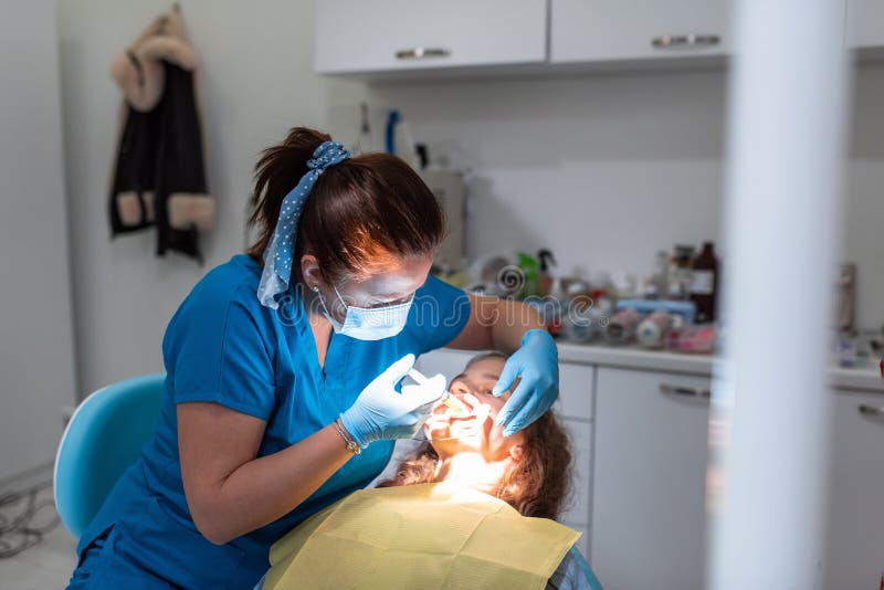 Dentist Appointment at a Dental Clinic, Placing Braces Locks on the