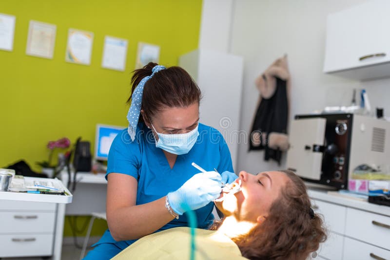 Dentist Appointment at a Dental Clinic, Placing Braces Locks on the