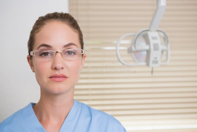 Dentist in Blue Scrubs Looking at Camera Stock Image Image of head
