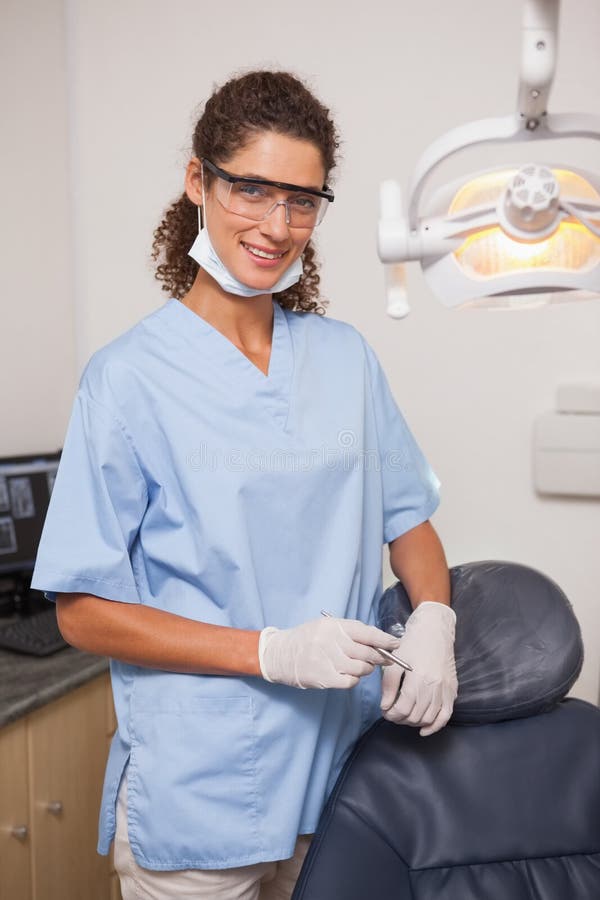 Dentist in Blue Scrubs Smiling at Camera Stock Image Image of dentist
