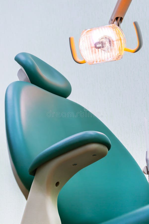 Dentist Chair with Lamp stock image. Image of hygiene 109281583