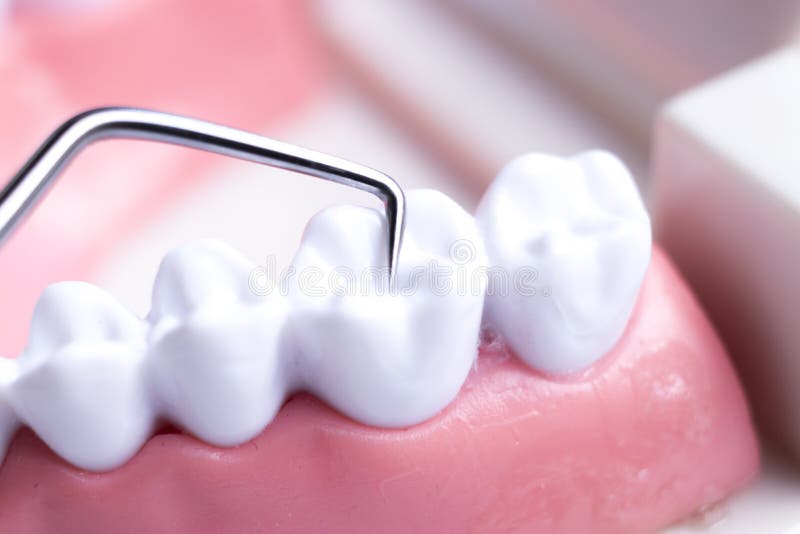 Dentist cleaning teeth stock photo. Image of clinic 125290964