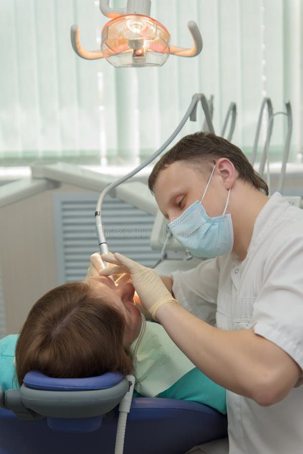 Dentist and patient. stock photo. Image of cleaning, blue 31221392