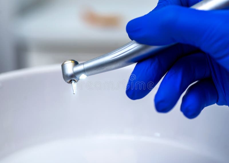 Dentist Doctor Hand Holding Dentist Tools in Dentist Clinic Stock Image