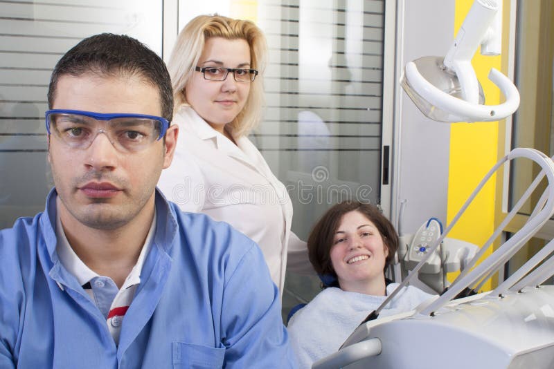 Dentist in exam room stock photo. Image of color, skill 58794968