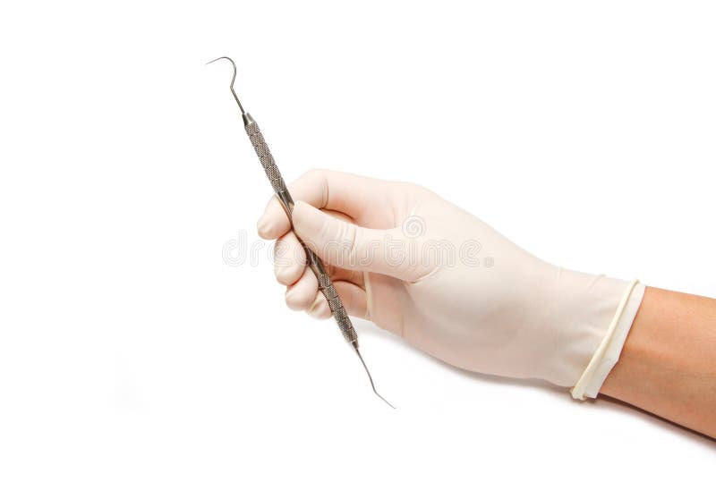 Dentist hand and dental tool stock image