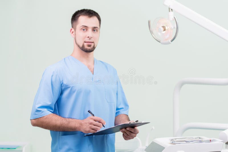 Dentist at his dental office royalty free stock images