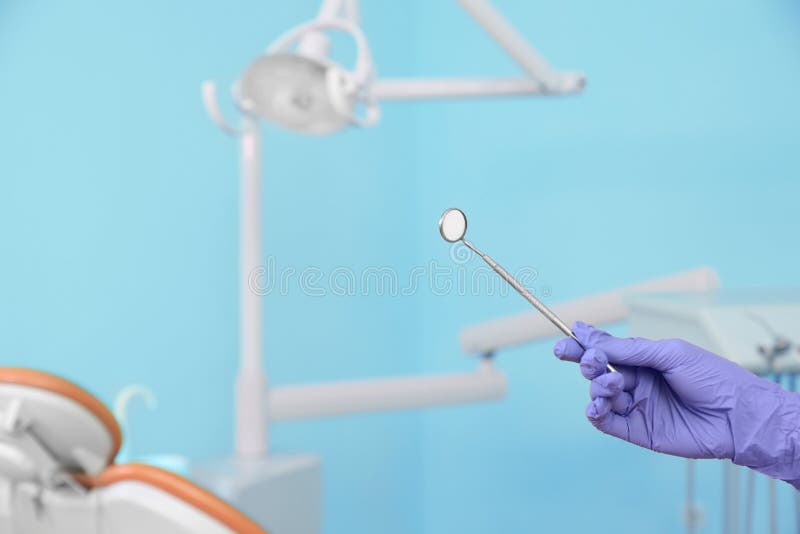 Dentist Holding Mirror in Clinic, Closeup of Hand Stock Image Image of blurred, female 151338851