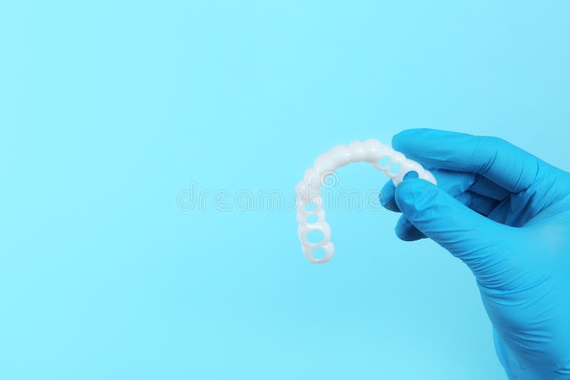 Dentist Holding Teeth Cover on Color Background Stock Image Image of