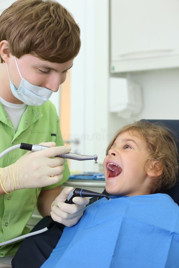 Dentist Holds Grinding Drill, Girl Opens Mouth Stock Image Image of