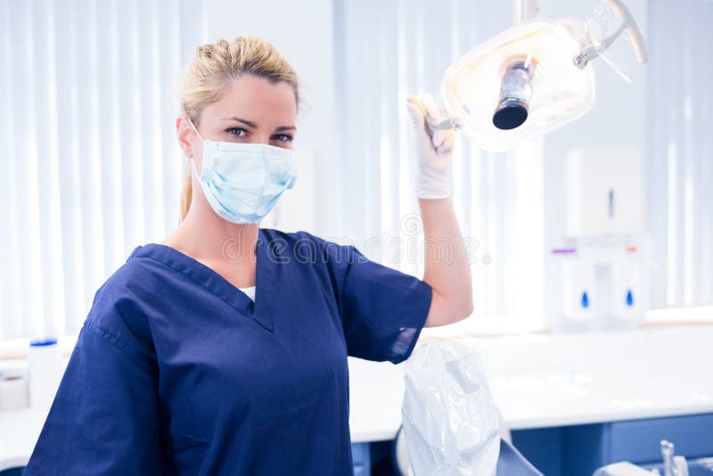 Female Dentist in Surgical Mask Holding Dental Drill Stock Image