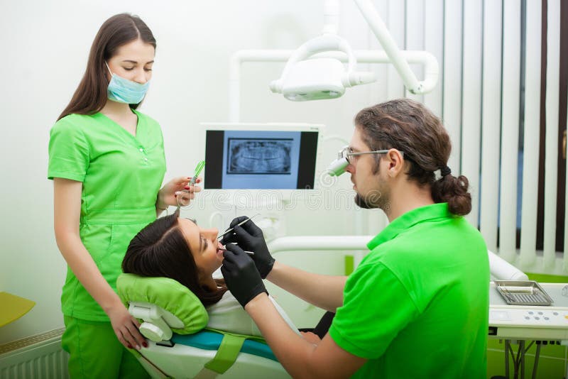 The Dentist Man are Treating Teeth To Client in Dental Office Stock Image Image of hygiene