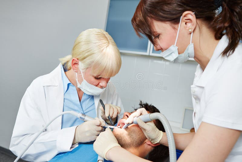 Dentist Performing Dental Surgery on Patient Stock Photo Image of