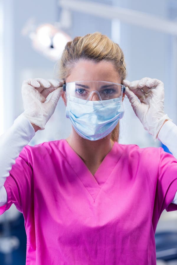 Dentist In Pink Scrubs Lookin