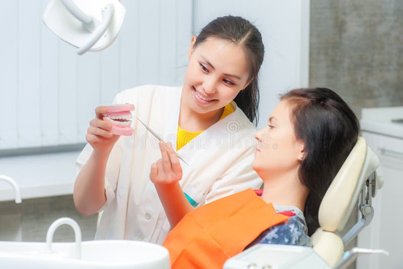 Dentist Show Dentures To a Patient Stock Photo Image of mouth, asian