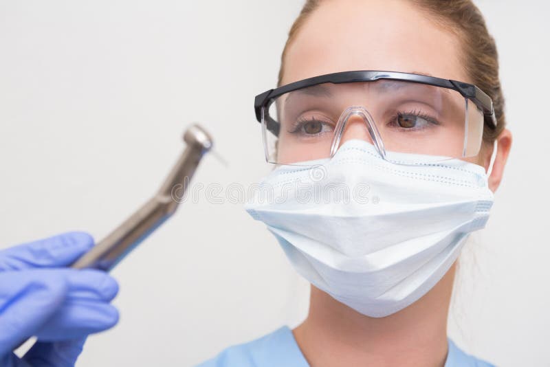 Dentist In Surgical Mask And Protective Glasses Holding ...