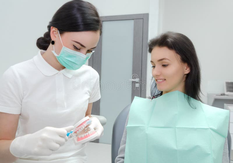 Dentist Teaching To Brush Teeth Stock Image Image of equipment