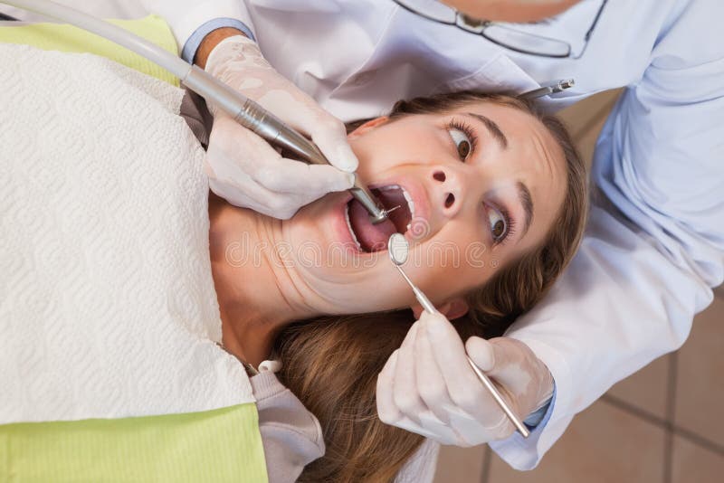 Dentist about To Pull a Terrified Patients Tooth Stock Image Image of