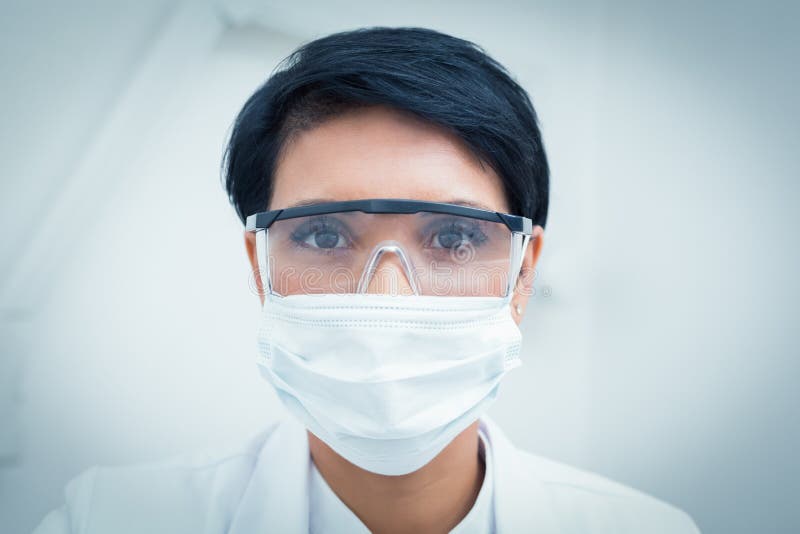 Dentist Wearing Surgical Mask And Safety Glasses Stock ...