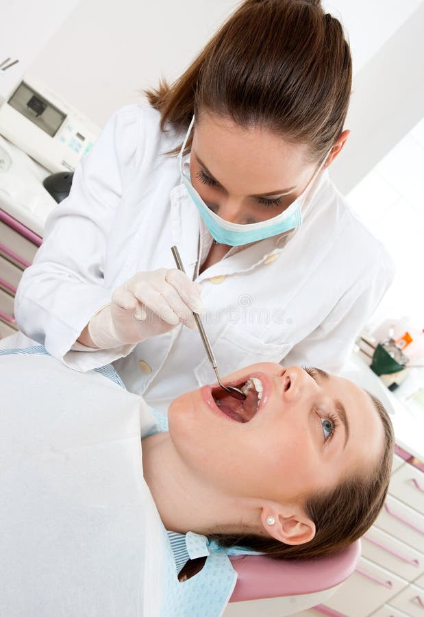 Dentist at work stock image. Image of look, dentist, examinate 19058631