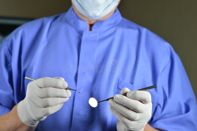 Dentista que hace el examen dental foto de archivo Dentista que hace el examen dental foto de archivo