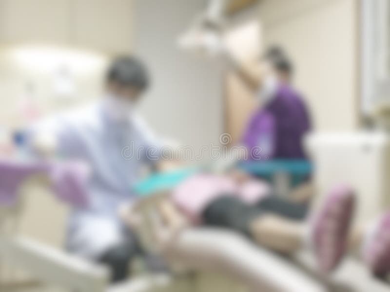 Dentistry blur background with dentist working on curing child patient who visiting dental clinic office, having teeth checkup. And orthodontic operation and royalty free stock photography Dentistry blur background with dentist working on curing child patient who visiting dental clinic office, having teeth checkup. And orthodontic operation and royalty free stock photography
