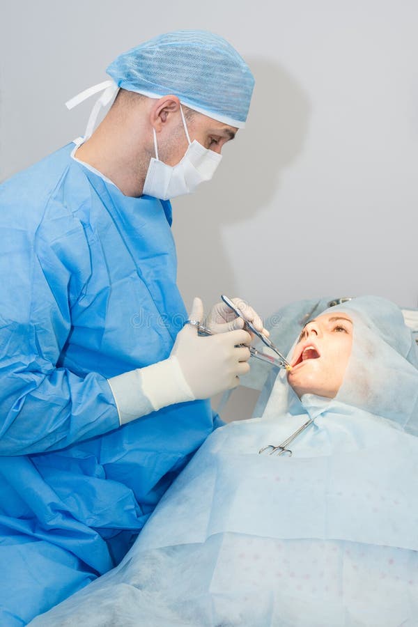 Dentists during surgery stock photo. Image of teeth, healthcare 58260026