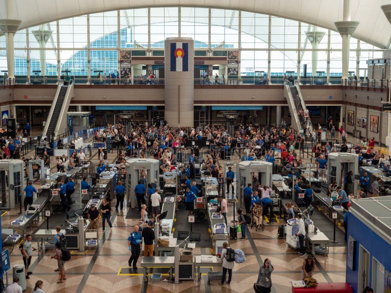 Large line of travelers backed up at security checkpoint at Denver International Airport