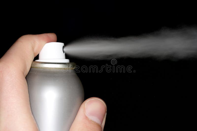 A close-up photo of deodorant in a hand on a black background.